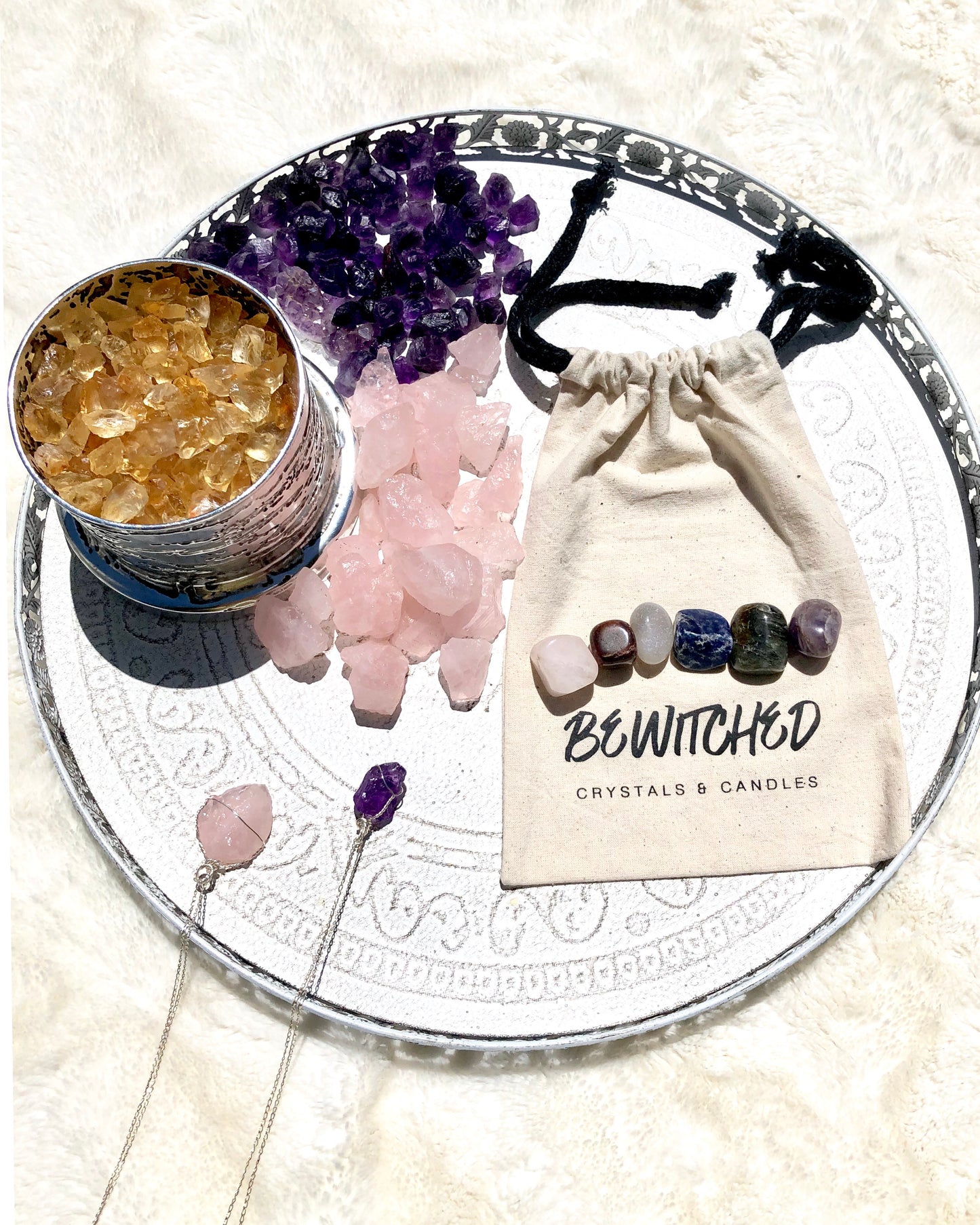 Anxiety crystal kit crystals on branded cloth bag with collection of citrine, amethyst and necklaces
