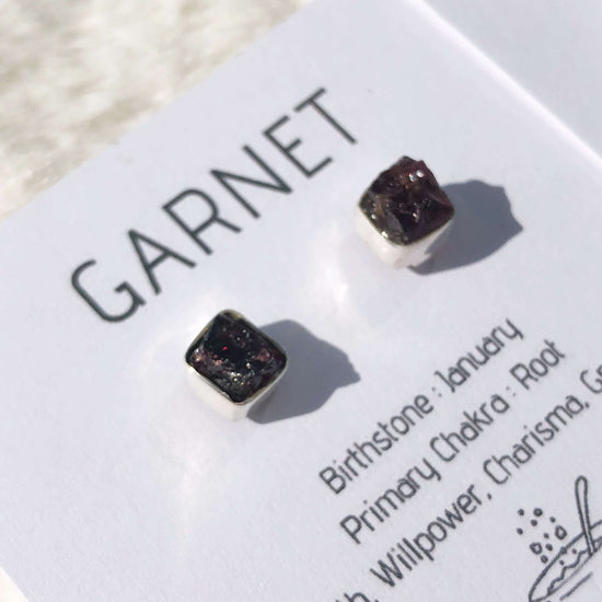 Garnet crystal stud earrings close up