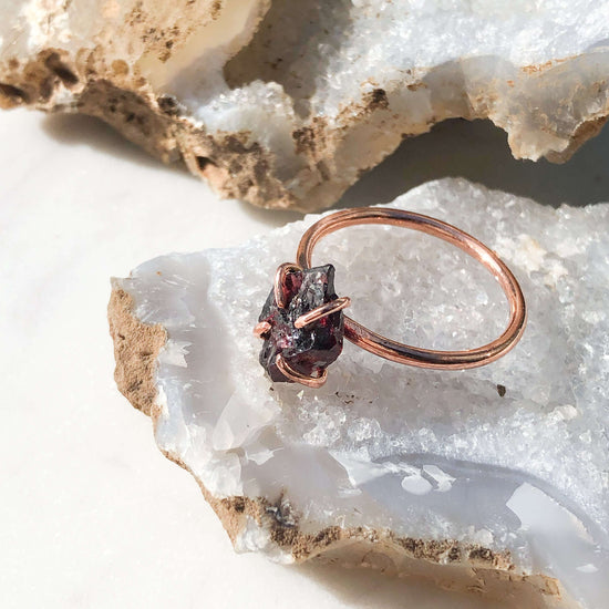 Garnet ring on open crystal