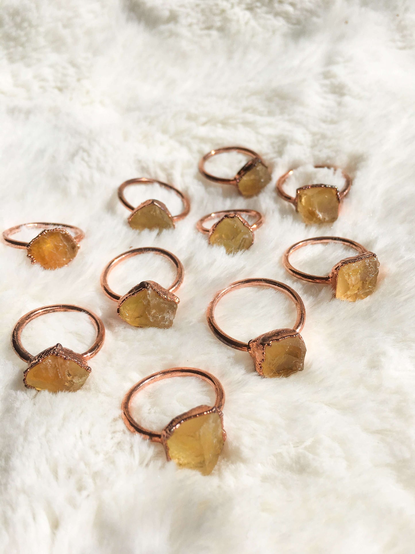 Load image into Gallery viewer, Collection fo citrine rings together of different sizes
