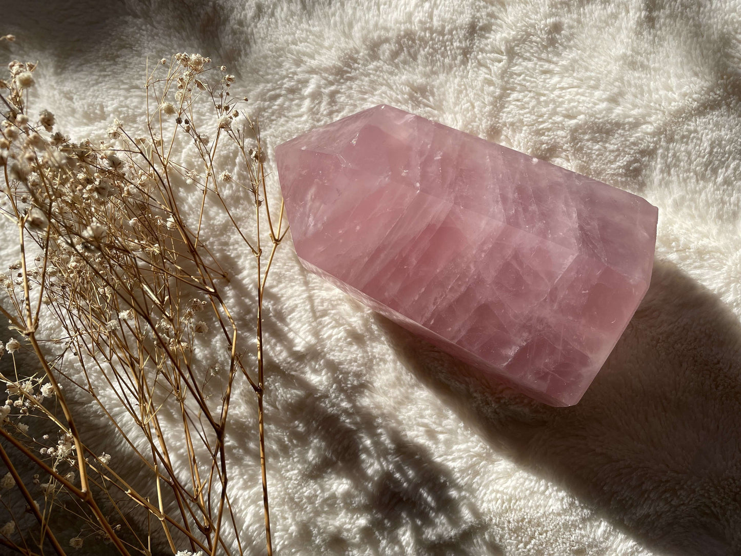 Rose quartz crystal point