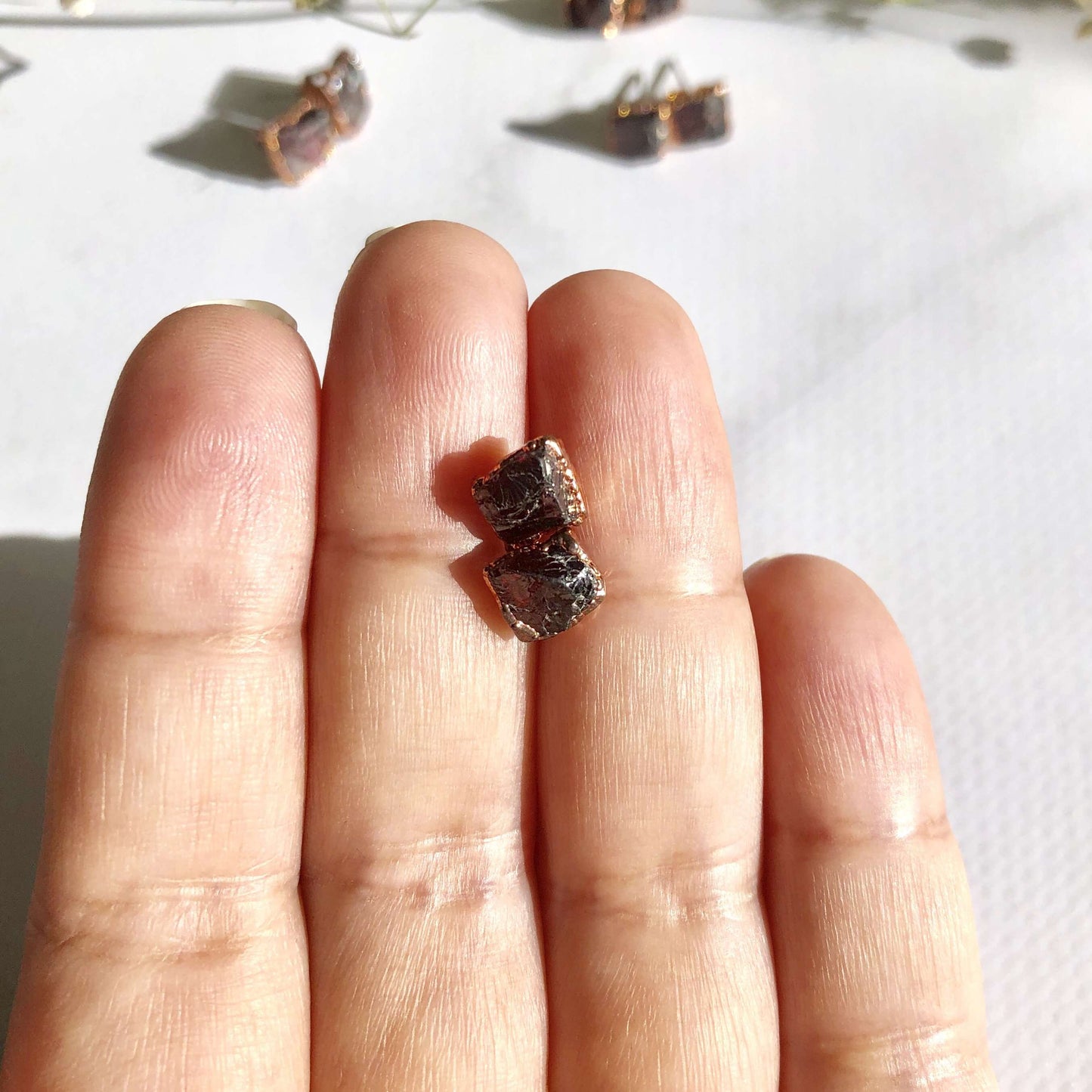 Garnet crystall earrings in hand